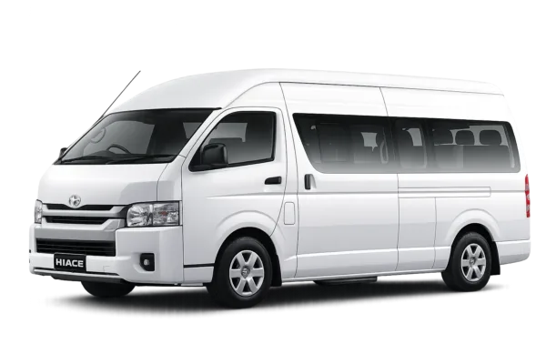 Toyota Hiace Commuter putih tampak serong depan dan samping untuk layanan sewa Hiace Jakarta dengan driver profesional